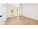 Sun-filled bedroom with wood floors and two windows at 1183 Farm Quarter Rd, Mount Pleasant, SC 29464