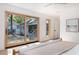 Bright bedroom featuring sliding glass doors to backyard and minimalist decor at 1183 Farm Quarter Rd, Mount Pleasant, SC 29464