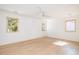 Bright, airy bedroom features wood floors, white walls and three large picture windows at 1183 Farm Quarter Rd, Mount Pleasant, SC 29464