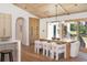 Dining area featuring modern furniture, a wood table, and natural light at 1183 Farm Quarter Rd, Mount Pleasant, SC 29464