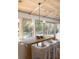 Bright dining area with backyard views, modern light fixture, comfortable seating, and access to outdoor space at 1183 Farm Quarter Rd, Mount Pleasant, SC 29464