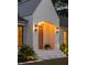 Exterior shot of the front entrance, featuring a covered entryway and manicured landscaping at 1183 Farm Quarter Rd, Mount Pleasant, SC 29464