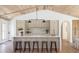 Stylish kitchen with bar stools, a spacious island, modern appliances, and a seamless flow into the living spaces at 1183 Farm Quarter Rd, Mount Pleasant, SC 29464