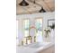 Bright kitchen featuring a gold faucet, farmhouse sink, and views from windows at 1183 Farm Quarter Rd, Mount Pleasant, SC 29464
