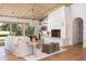 Open living room with a fireplace, wood ceiling, and sliding doors to the backyard at 1183 Farm Quarter Rd, Mount Pleasant, SC 29464