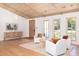 Living room with light wood floors, vaulted ceilings, recessed lights, and white fabric chairs at 1183 Farm Quarter Rd, Mount Pleasant, SC 29464