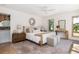 Bright main bedroom with natural light, wood flooring, and an ensuite bathroom at 1183 Farm Quarter Rd, Mount Pleasant, SC 29464