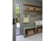 Mudroom featuring built-in bench seating, storage shelves, and stylish decor at 1183 Farm Quarter Rd, Mount Pleasant, SC 29464