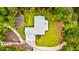 Aerial view of a modern farmhouse with a metal roof and surrounded by lush greenery at 1183 Guerins Bridge Rd, Awendaw, SC 29429