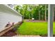 Lush backyard view with vibrant greenery and privacy, visible from the property, highlighting the outdoor space at 1183 Guerins Bridge Rd, Awendaw, SC 29429