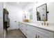 Modern bathroom with white cabinets, dual sinks, gold hardware, and a shower at 1183 Guerins Bridge Rd, Awendaw, SC 29429