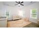 Inviting Bedroom with a white crib and rocking chair with views of the backyard at 1183 Guerins Bridge Rd, Awendaw, SC 29429