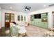 Inviting living room with a large sectional sofa, custom shelving, ceiling fan and a neutral area rug at 1183 Guerins Bridge Rd, Awendaw, SC 29429