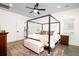 Inviting main bedroom with a four-poster bed, creating a relaxing and stylish retreat within the home at 1183 Guerins Bridge Rd, Awendaw, SC 29429