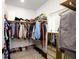 Spacious walk-in closet with custom shelving, hanging racks, and a mirror at 1183 Guerins Bridge Rd, Awendaw, SC 29429