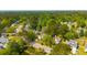 Aerial view of residential street surrounded by trees, landscaping, and pond views at 119 Alwyn Blvd, Summerville, SC 29485