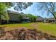 Large backyard features a shed, mature trees, lawn, and the home's exterior, blending outdoor living with nature at 119 Alwyn Blvd, Summerville, SC 29485