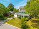 An eye-level aerial view of this home with green shutters surrounded by lush trees at 119 Alwyn Blvd, Summerville, SC 29485