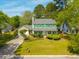 Aerial view of a charming two-story home featuring green shutters and a spacious yard with mature trees at 119 Alwyn Blvd, Summerville, SC 29485