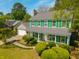 An eye-level aerial view of this home with green shutters surrounded by lush trees at 119 Alwyn Blvd, Summerville, SC 29485