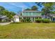 Charming two-story home with green shutters, a manicured lawn, and attached two car garage at 119 Alwyn Blvd, Summerville, SC 29485