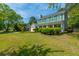 Charming two-story home featuring green shutters, covered front porch and a spacious front yard with mature trees at 119 Alwyn Blvd, Summerville, SC 29485