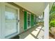 Inviting front porch with storm door and view of windows with green shutters at 119 Alwyn Blvd, Summerville, SC 29485
