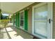 Inviting front porch featuring classic architecture, bright green shutters, and plenty of curb appeal at 119 Alwyn Blvd, Summerville, SC 29485
