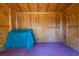 Interior of shed with plywood walls and floor, offering ample storage space and potential for customization at 119 Alwyn Blvd, Summerville, SC 29485