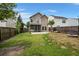 Fenced backyard with a patio, screened-in porch, and lawn at 121 Dream St, Summerville, SC 29483