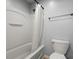 Clean bathroom featuring a white tub and shower combination with a shower curtain and a standard toilet at 121 Dream St, Summerville, SC 29483