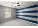 Bright bedroom with horizontal stripes, ceiling fan and one window at 121 Dream St, Summerville, SC 29483