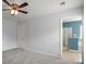 Neutral bedroom with a ceiling fan showing the ensuite bathroom through the doorway at 121 Dream St, Summerville, SC 29483