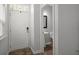 Home entryway with a white front door, a small rug, and a view of a half bathroom at 121 Dream St, Summerville, SC 29483