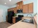 Well-lit kitchen featuring stainless steel appliances and wooden cabinets at 121 Dream St, Summerville, SC 29483