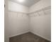 Walk-in closet with metal shelving, carpeted floor, and plenty of storage space at 121 Dream St, Summerville, SC 29483