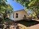 Backyard view with a well-maintained lawn, wooden deck, and partially shaded area at 124 Droos Way, Charleston, SC 29414