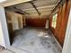 Spacious garage with concrete floor, overhead door, and ample storage area at 124 Droos Way, Charleston, SC 29414