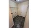 Functional laundry room with tile flooring, wire shelving, and utility connections at 124 Droos Way, Charleston, SC 29414