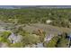 Aerial view of home, waterway, and surrounding trees in a lush neighborhood at 1242 Creek Watch, Seabrook Island, SC 29455