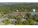 Scenic aerial view of lush wooded neighborhood with water tower and waterway at 1242 Creek Watch, Seabrook Island, SC 29455