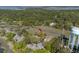 Scenic aerial view of lush wooded neighborhood and waterway at 1242 Creek Watch, Seabrook Island, SC 29455
