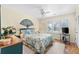 Cozy bedroom featuring wood floors, closet, and window with plantation shutters at 1242 Creek Watch, Seabrook Island, SC 29455