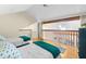 Bright bedroom featuring two twin beds, hardwood floors, and an open loft area for spacious, comfortable living at 1242 Creek Watch, Seabrook Island, SC 29455