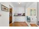 Hallway with white cabinets, granite countertops, and decor provides ample storage and style at 1242 Creek Watch, Seabrook Island, SC 29455