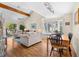 Bright living room featuring a beamed ceiling, ceiling fan, wood floors, and generous seating at 1242 Creek Watch, Seabrook Island, SC 29455