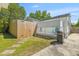 Private backyard with a wooden fence, lawn, a grill, and a concrete patio area, perfect for outdoor activities at 1324 Maxwell St, North Charleston, SC 29405