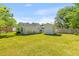 Lush backyard with ample green space, perfect for gardening, recreation, or future expansions at 1324 Maxwell St, North Charleston, SC 29405