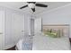 Cozy bedroom with a ceiling fan and a comfortable bed with decorative pillows at 1324 Maxwell St, North Charleston, SC 29405
