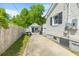 Long driveway leading to the backyard with ample space for parking and a detached garage at 1324 Maxwell St, North Charleston, SC 29405